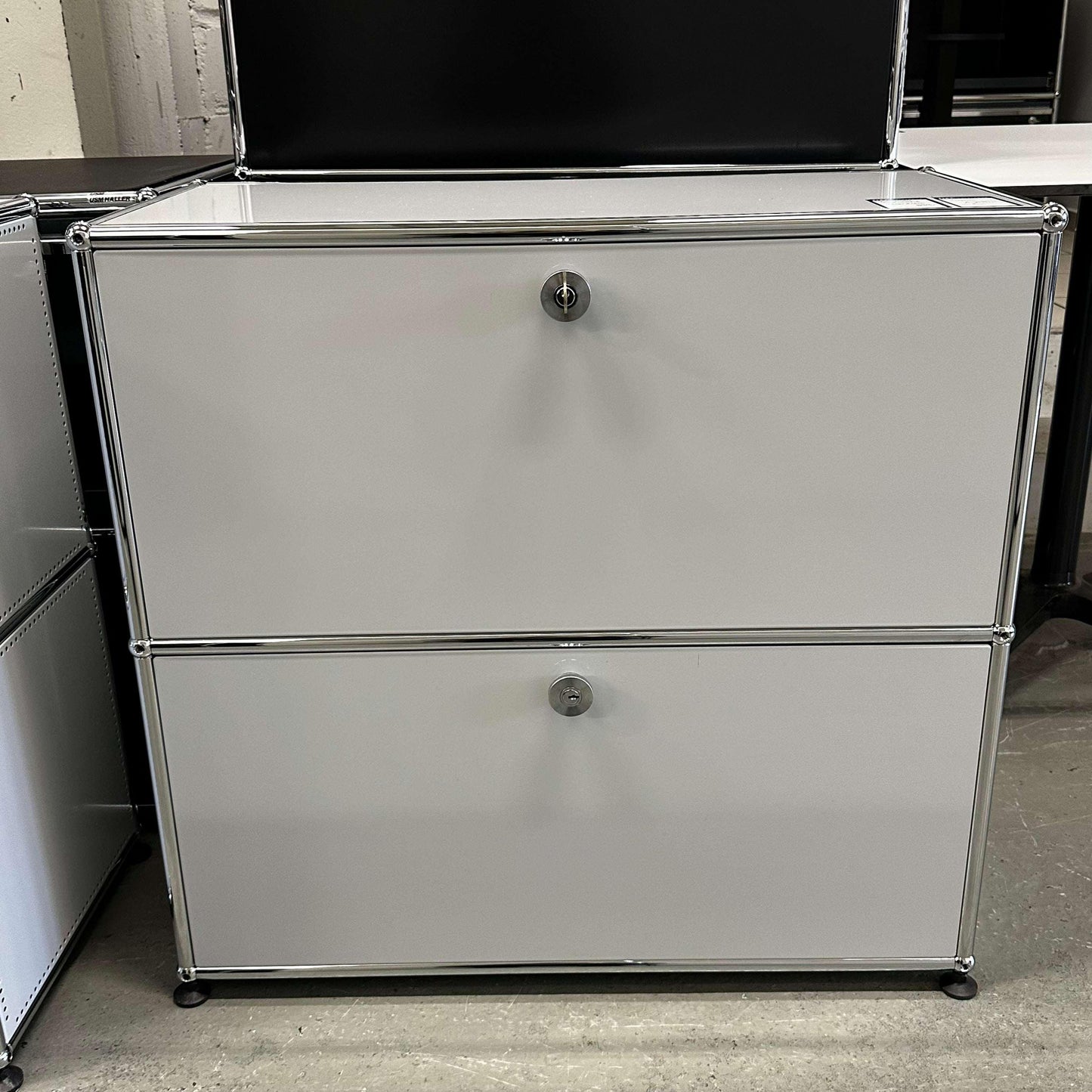 USM Haller Sideboard in light gray with 2 compartments and chrome frame