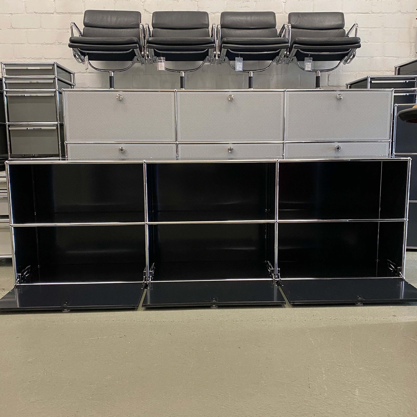 Black USM Haller Sideboard with three drop-down doors and open compartments, measuring 228x74x38cm