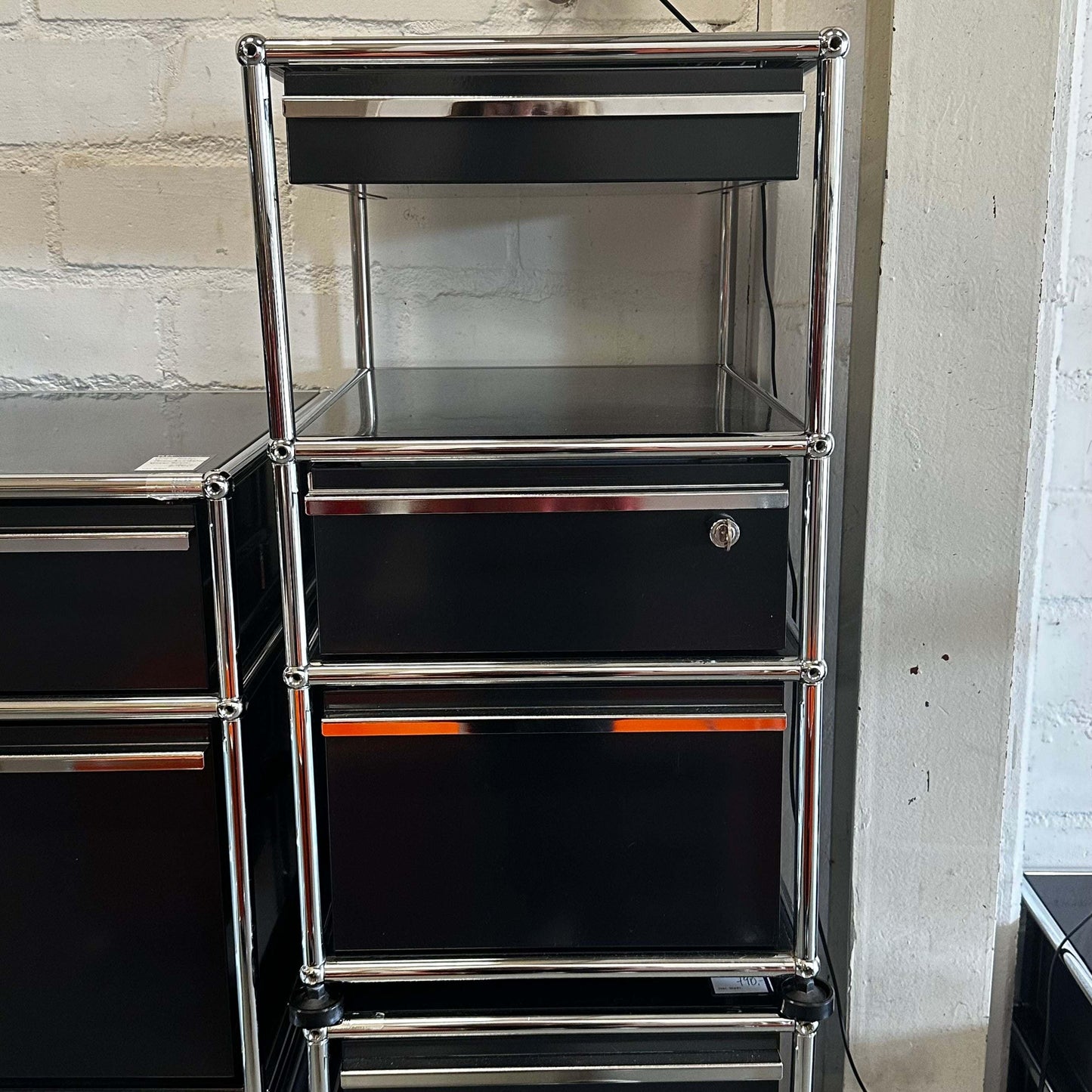 Black USM Haller stand container with three drawers and chrome frame