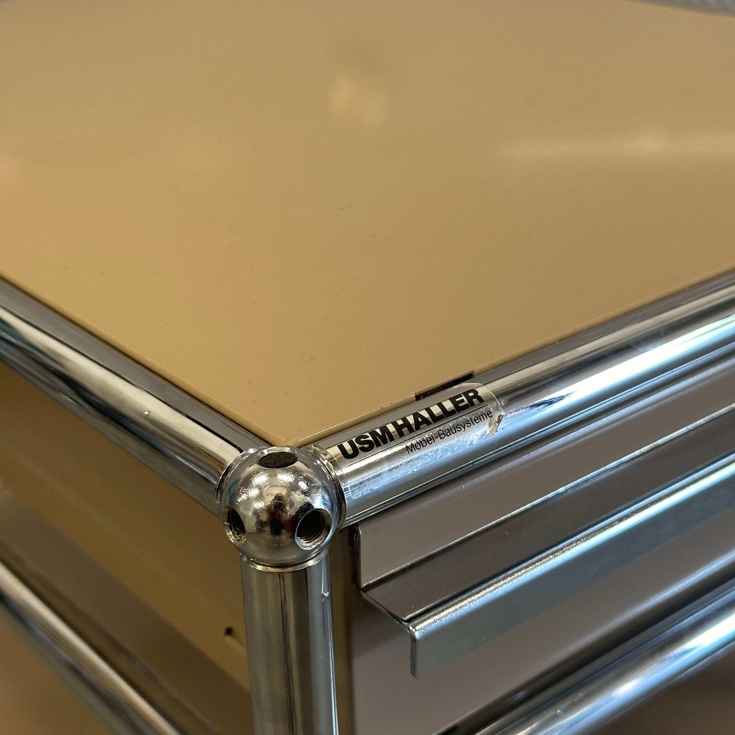 USM Haller beige standcontainer with one drawer and chrome frame detail