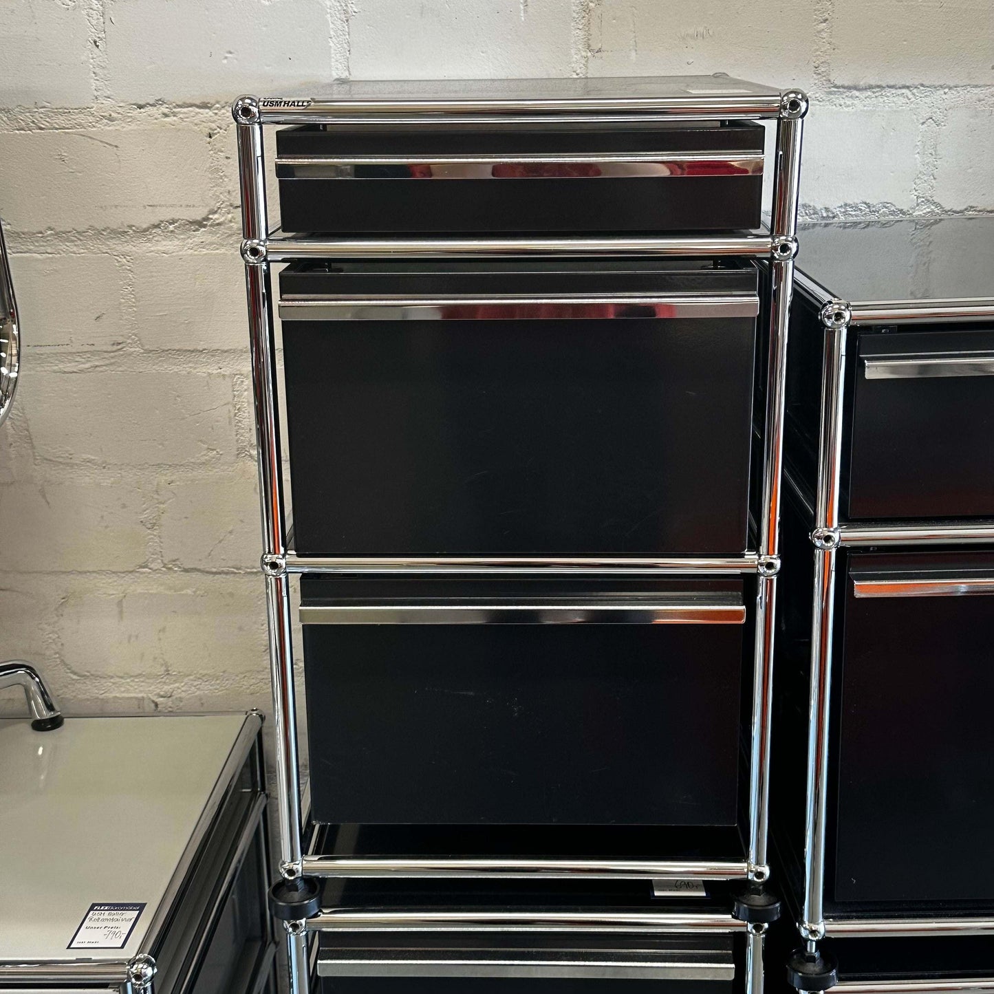 Black USM Haller stand container with three drawers and chrome frame