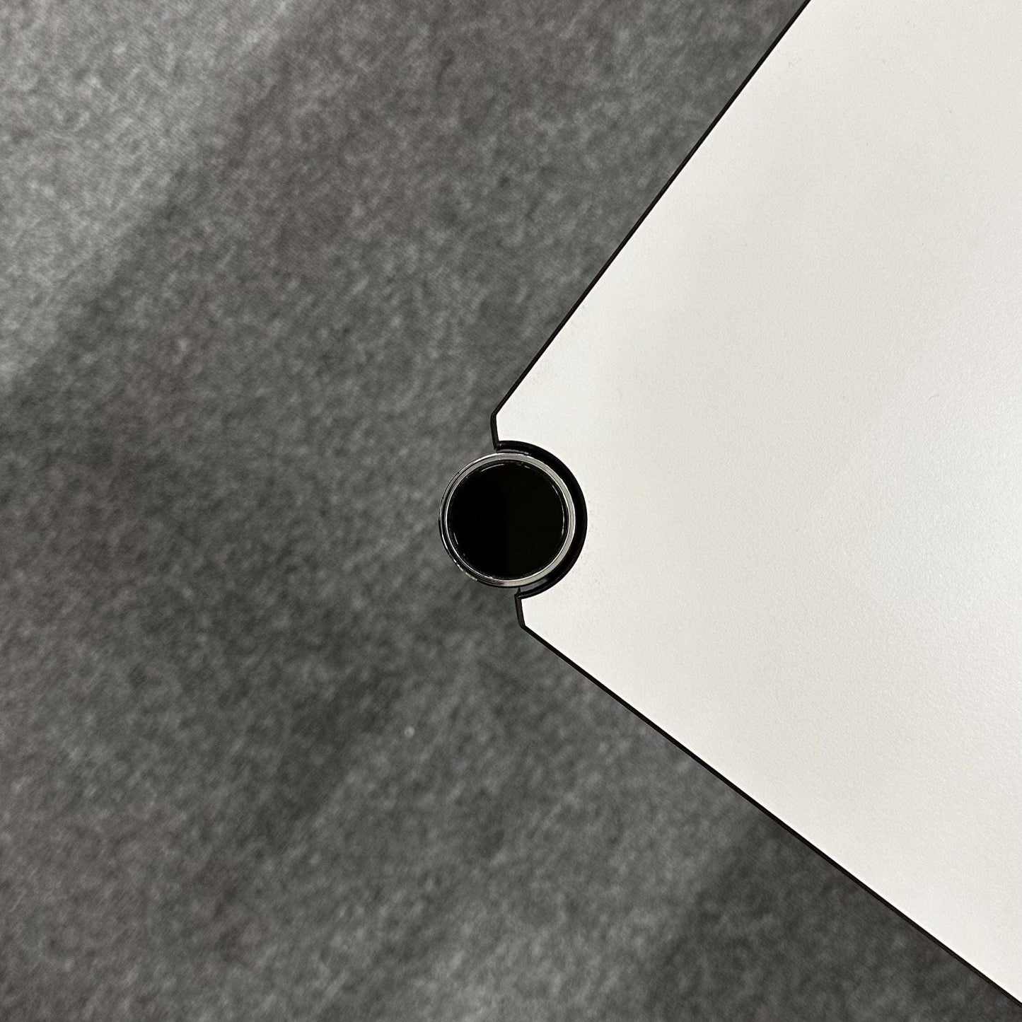 Corner detail of USM Haller Tisch 125x75cm in perlgrau and white with chromed frame
