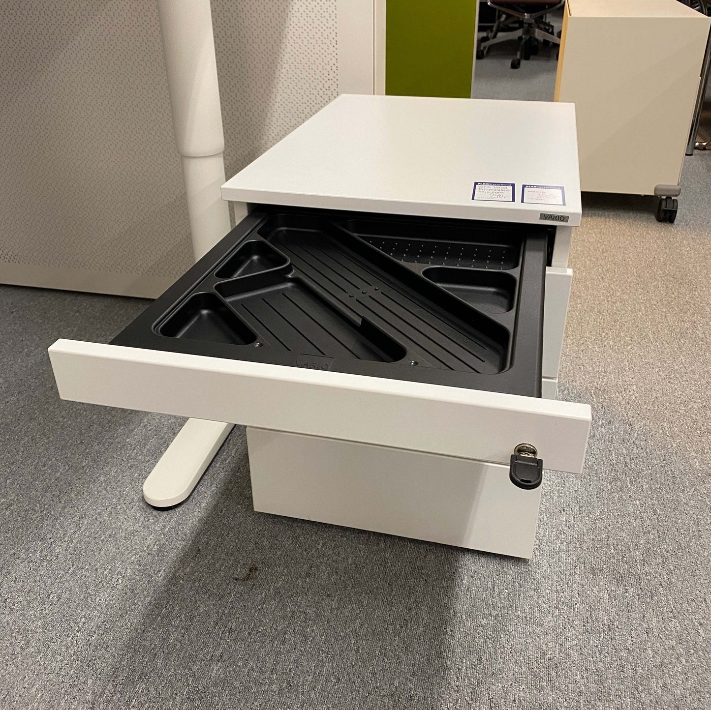 White Vario Versa Rollcontainer with four drawers, one open showing black organizer tray, compact office storage unit.