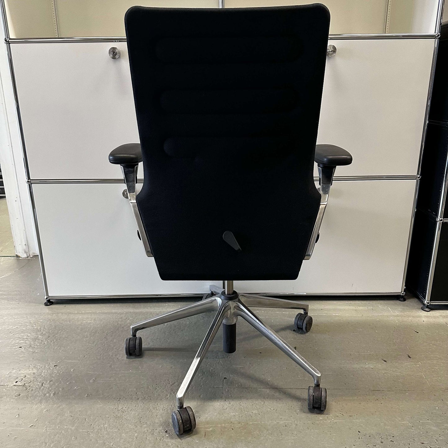 Vitra AC 4 ergonomic black office chair with chrome frame viewed from the back