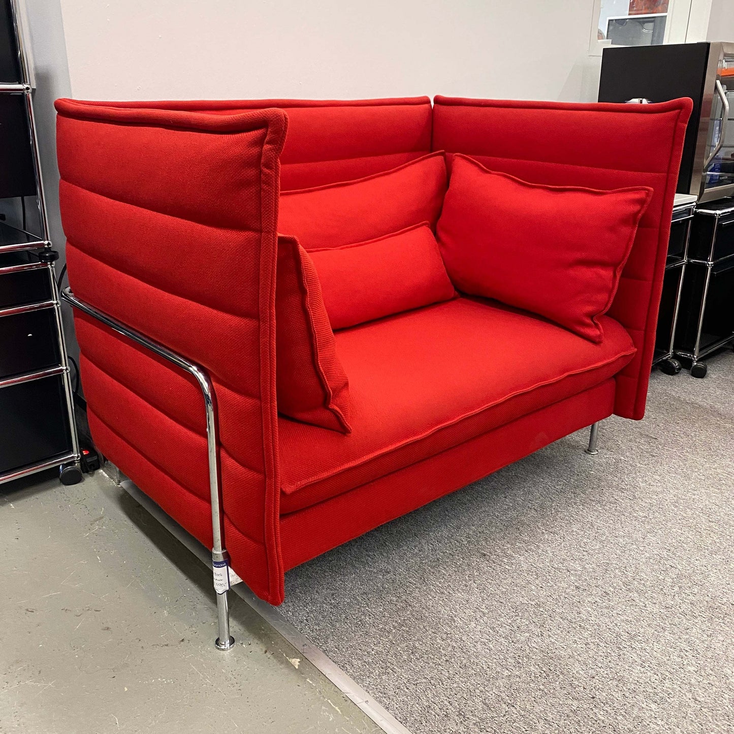 Red Vitra Alcove Lowback Love Seat with cushions and metal legs in modern office setting