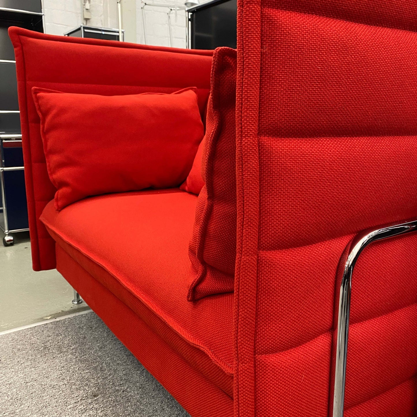 Red Vitra Alcove Lowback Love Seat with cushions and sleek chrome frame