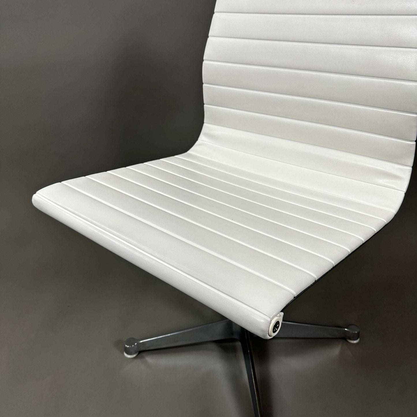 Vitra EA 101 white leather office chair with aluminum frame, non-swivel, armless design
