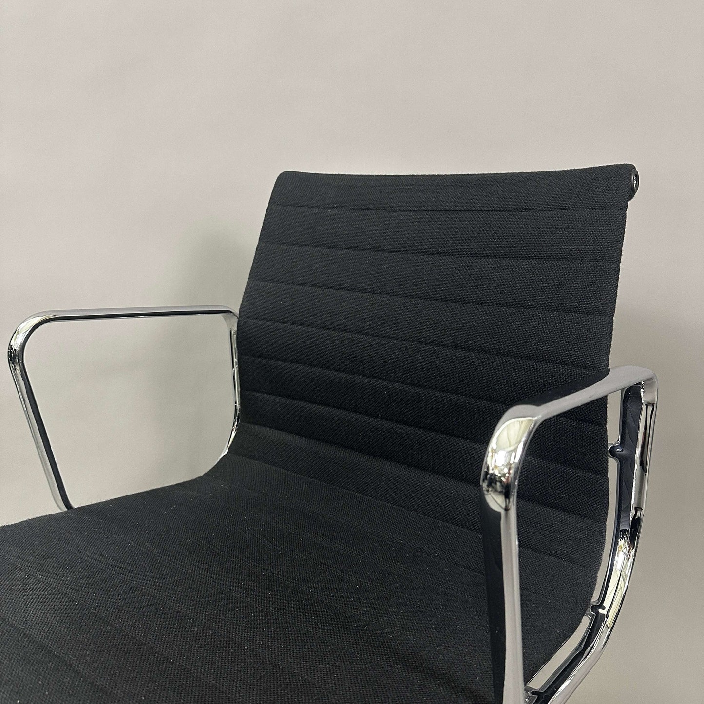 Vitra EA 108 black Hopsak fabric office chair with chrome frame and swivel feature