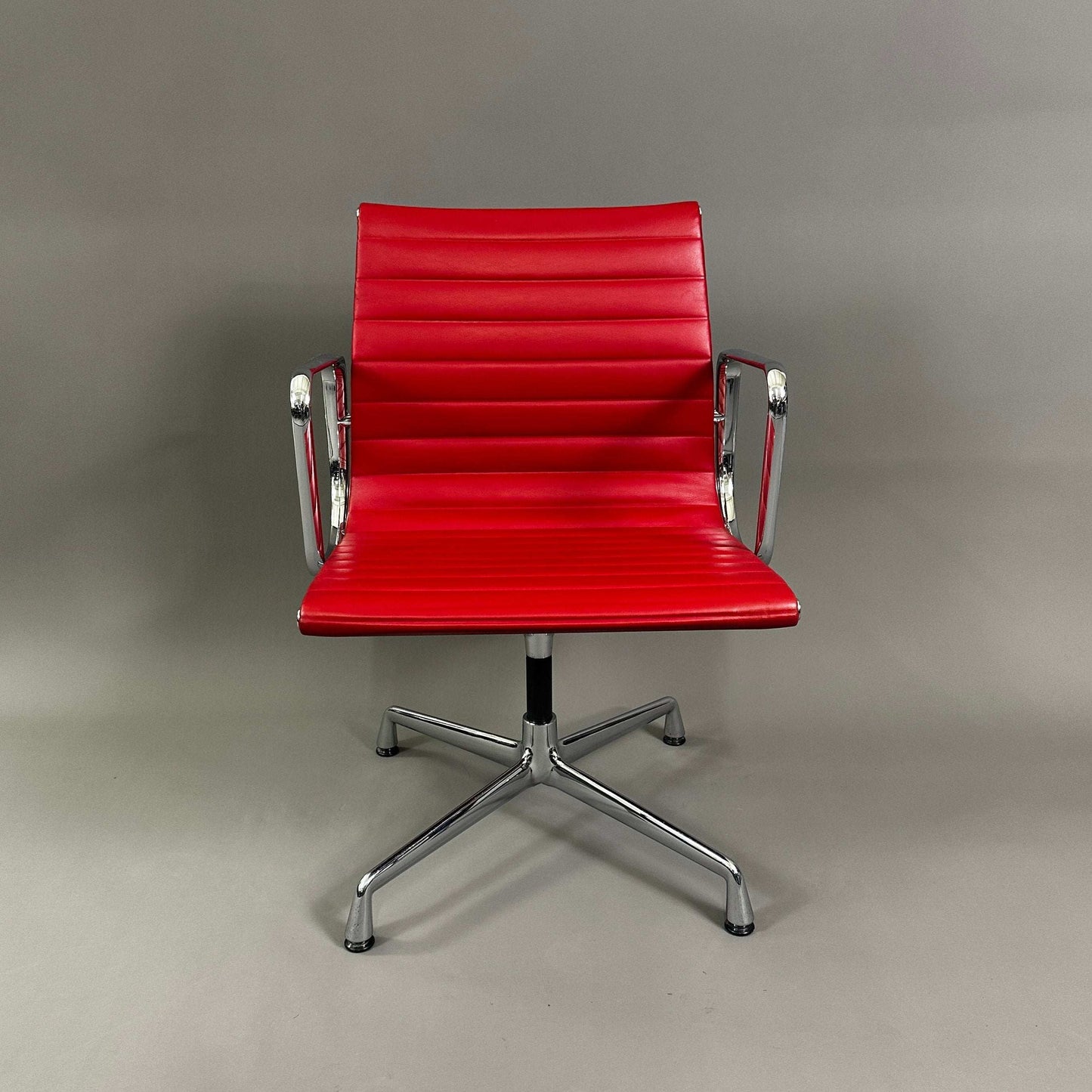 Vitra EA 108 red leather swivel office chair with chrome frame