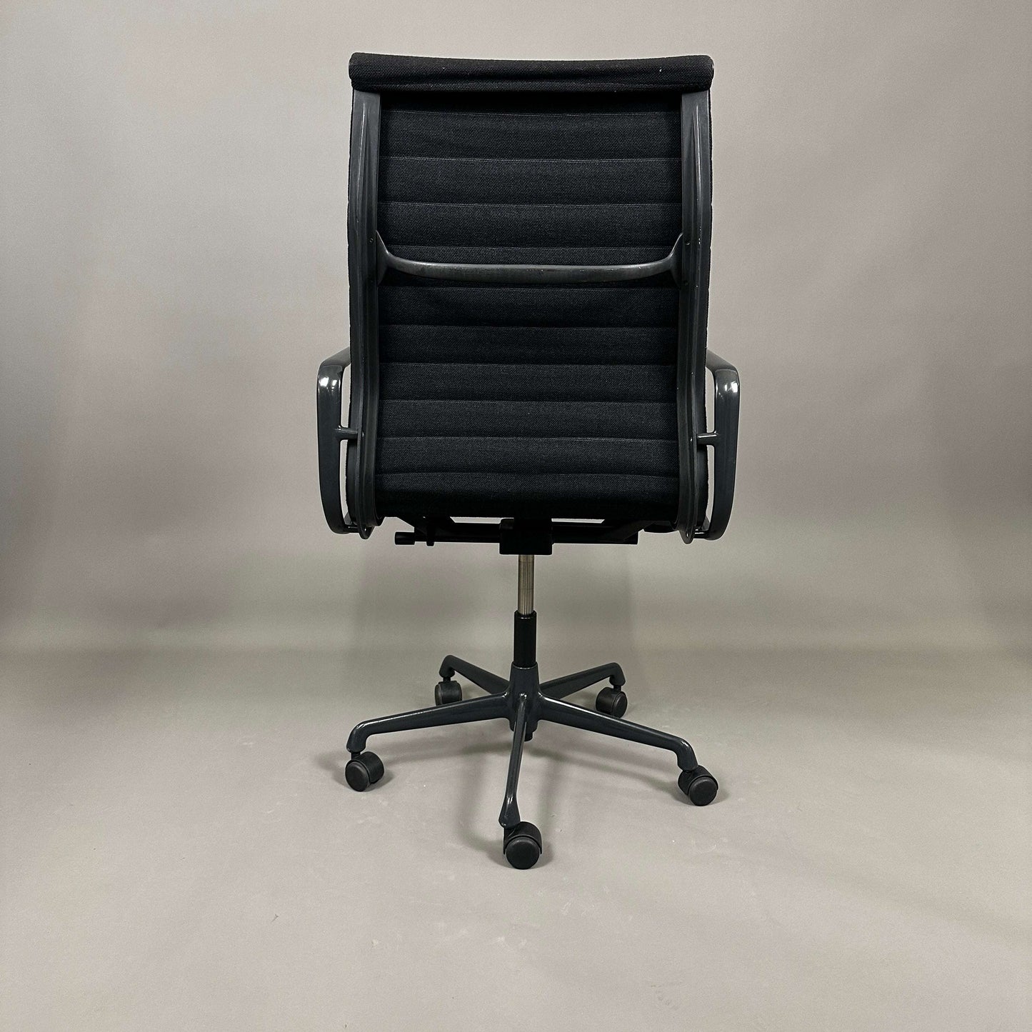 Vitra EA 119 Hopsak office chair with black hopsak fabric and black frame shown from the back