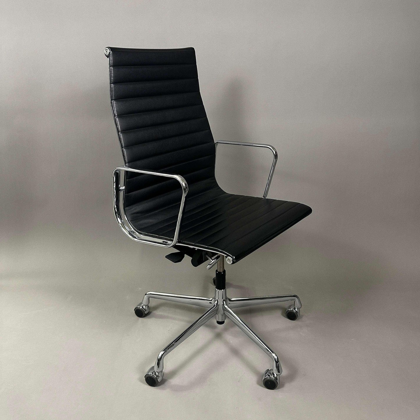 Vitra EA 119 black leather office chair with chrome frame and adjustable tilt function
