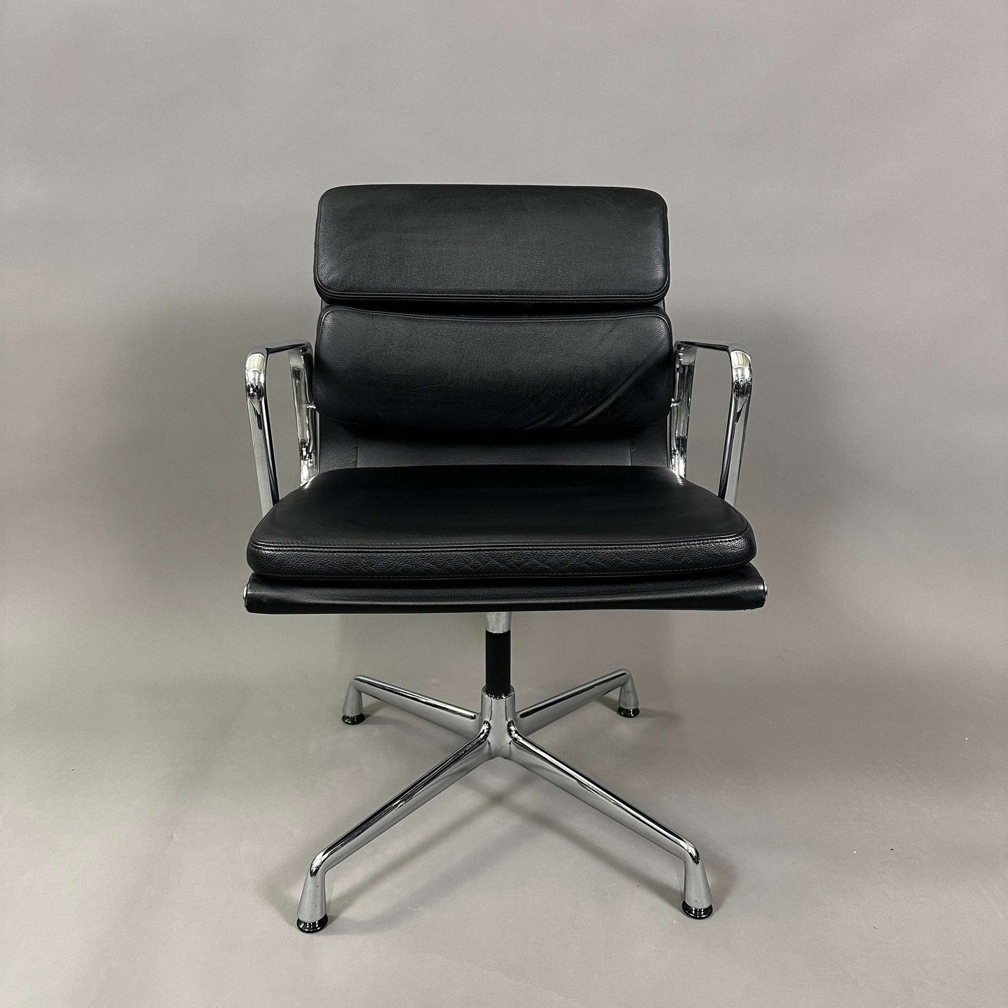 Vitra EA 208 black leather soft pad chair with chrome frame and swivel base
