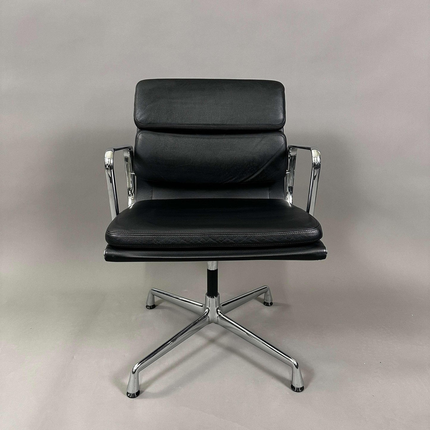 Vitra EA 208 black leather soft pad chair with chrome frame and swivel base