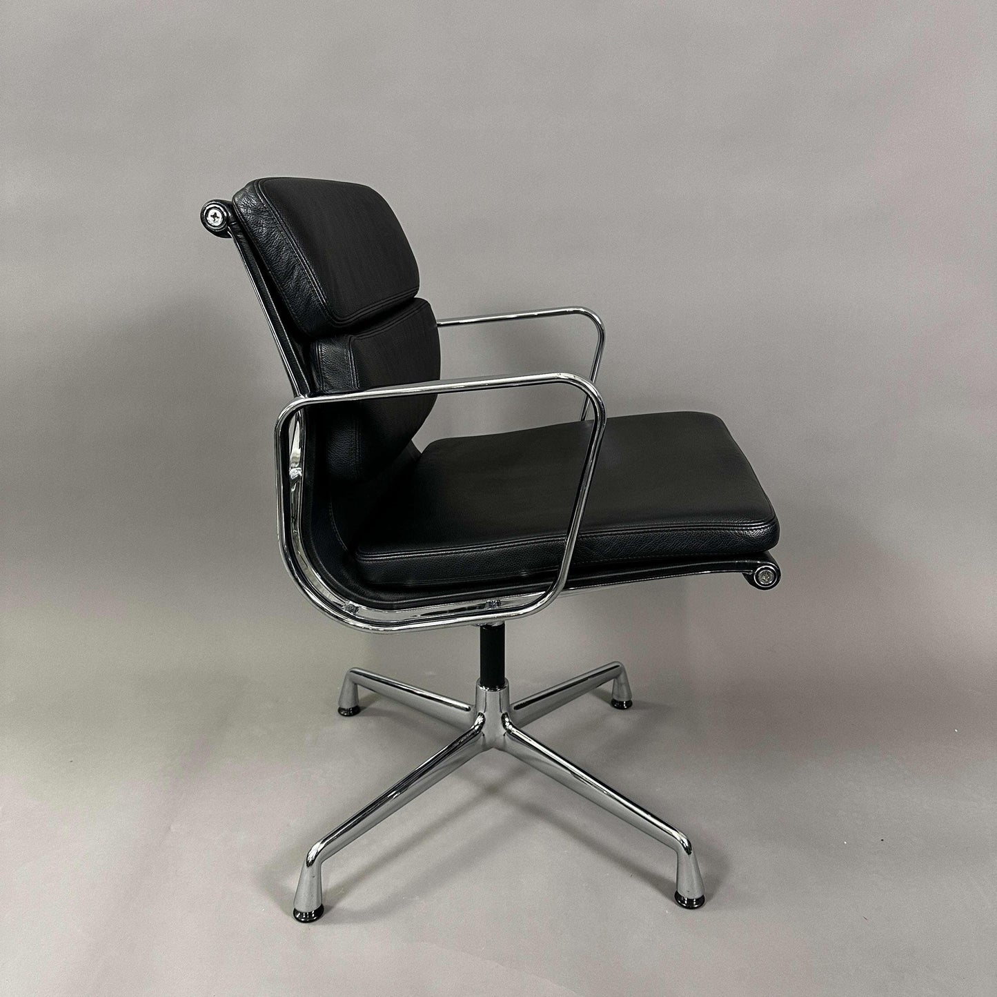 Vitra EA 208 black leather soft pad chair with chrome frame and swivel base