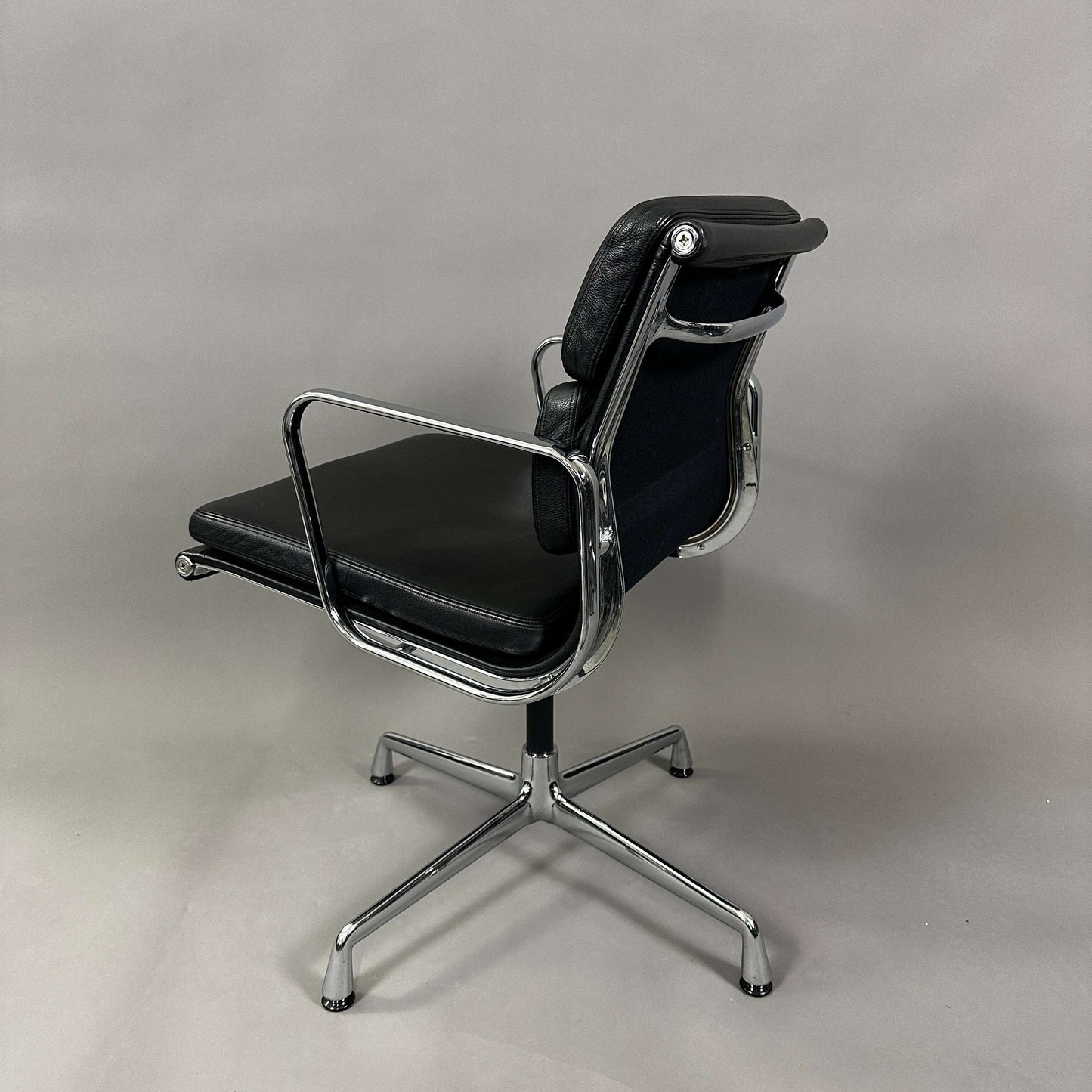 Vitra EA 208 black leather soft pad office chair with chrome swiveling frame