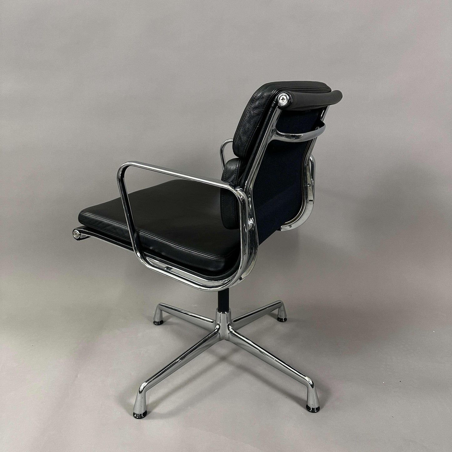 Vitra EA 208 black leather soft pad office chair with chrome swiveling frame