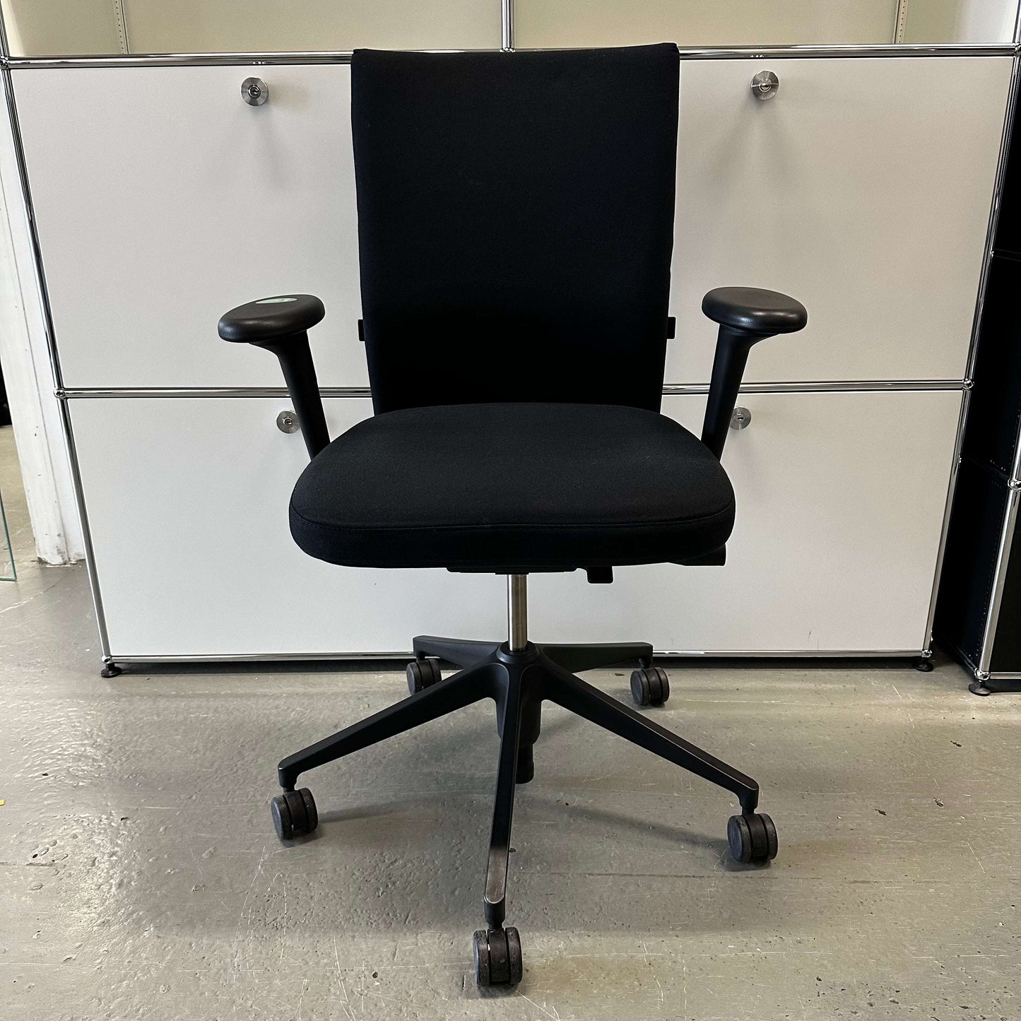 Vitra ID Soft black office chair with fabric upholstery and black plastic base, ergonomic design