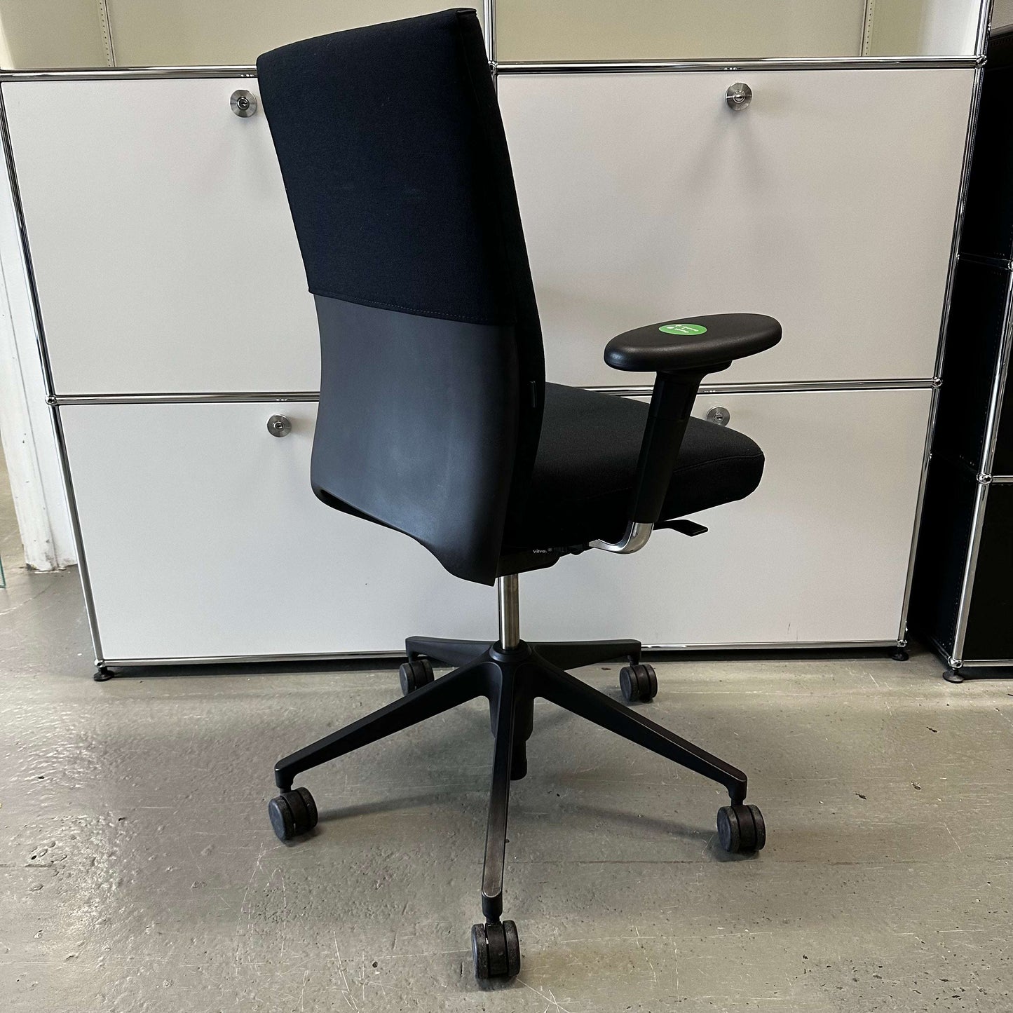 Vitra ID Soft black office chair with ergonomic design, fabric seat, and black plastic base