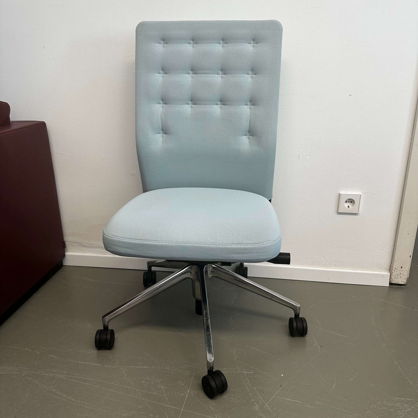 Light blue Vitra ID Trim office chair with adjustable lumbar support and patented reclining mechanism