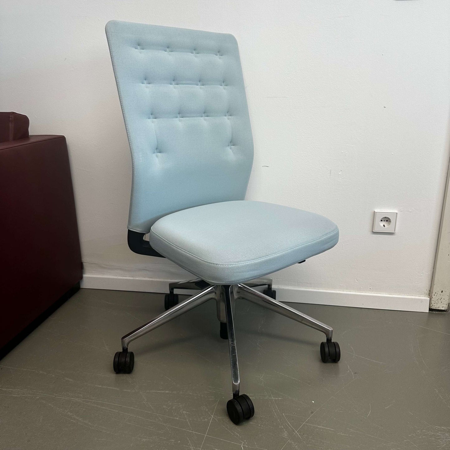 Light blue Vitra ID Trim office chair with patented mechanism, adjustable recline, lumbar support, and seat depth adjustment