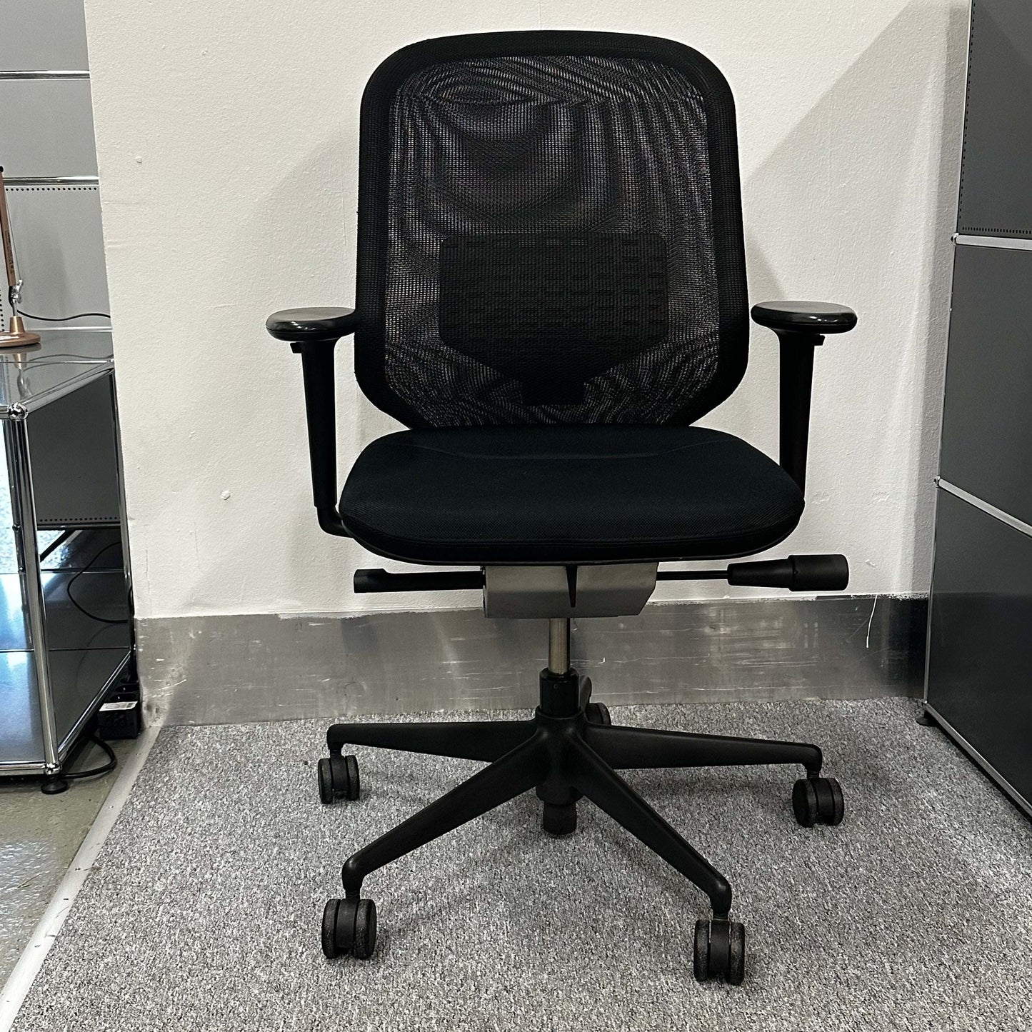 Vitra Meda Pro black office chair with adjustable height, lumbar support, and breathable mesh backrest
