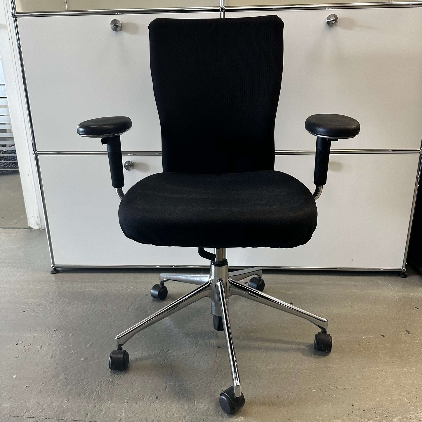 Black Vitra T-Chair office chair with adjustable armrests and chrome base on casters