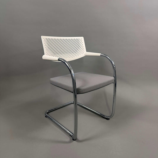 Vitra Visavis 2 chair with grey upholstered seat, white plastic backrest, and chrome frame, stackable design