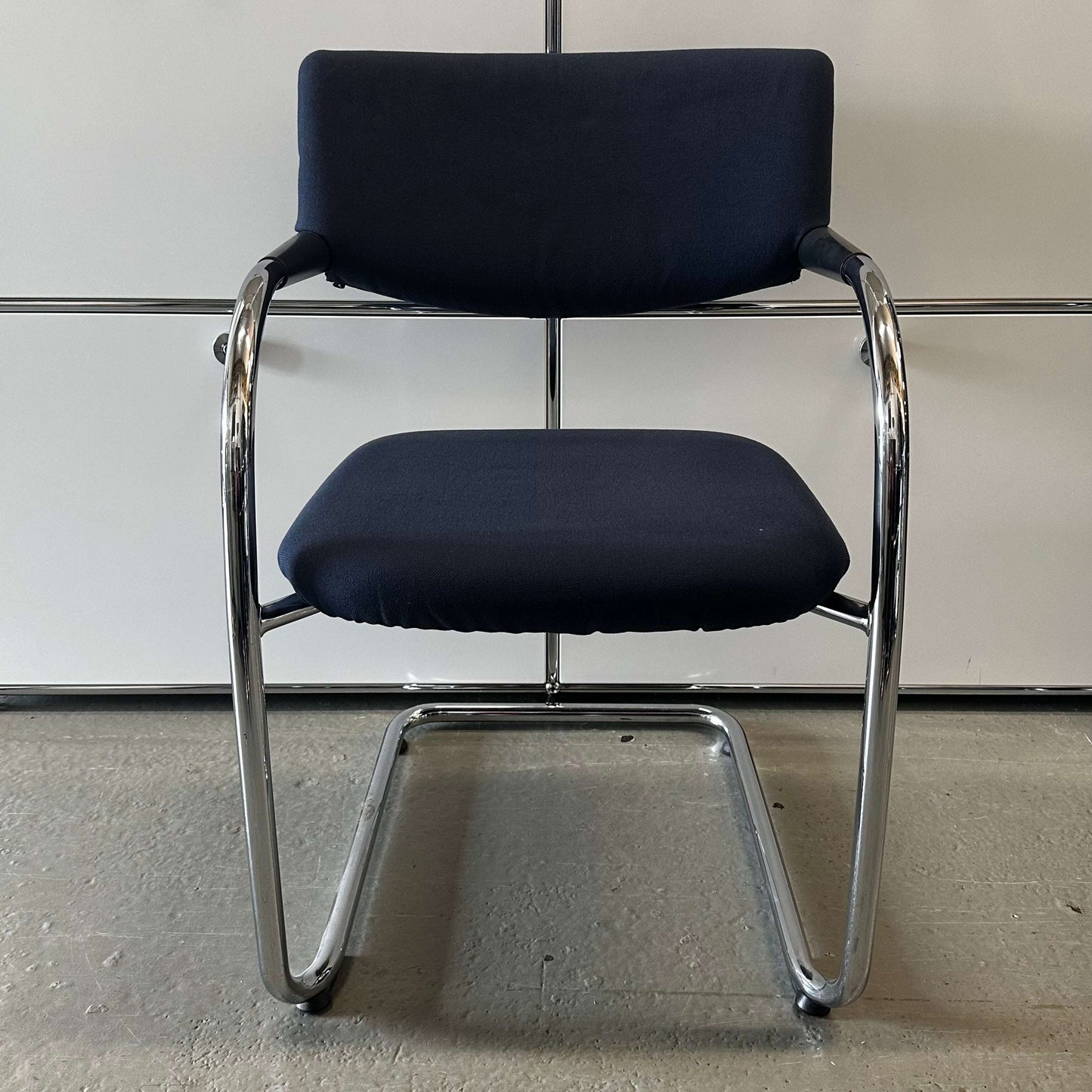 Vitra Visavis chair with dark blue padded softback and chrome cantilever frame