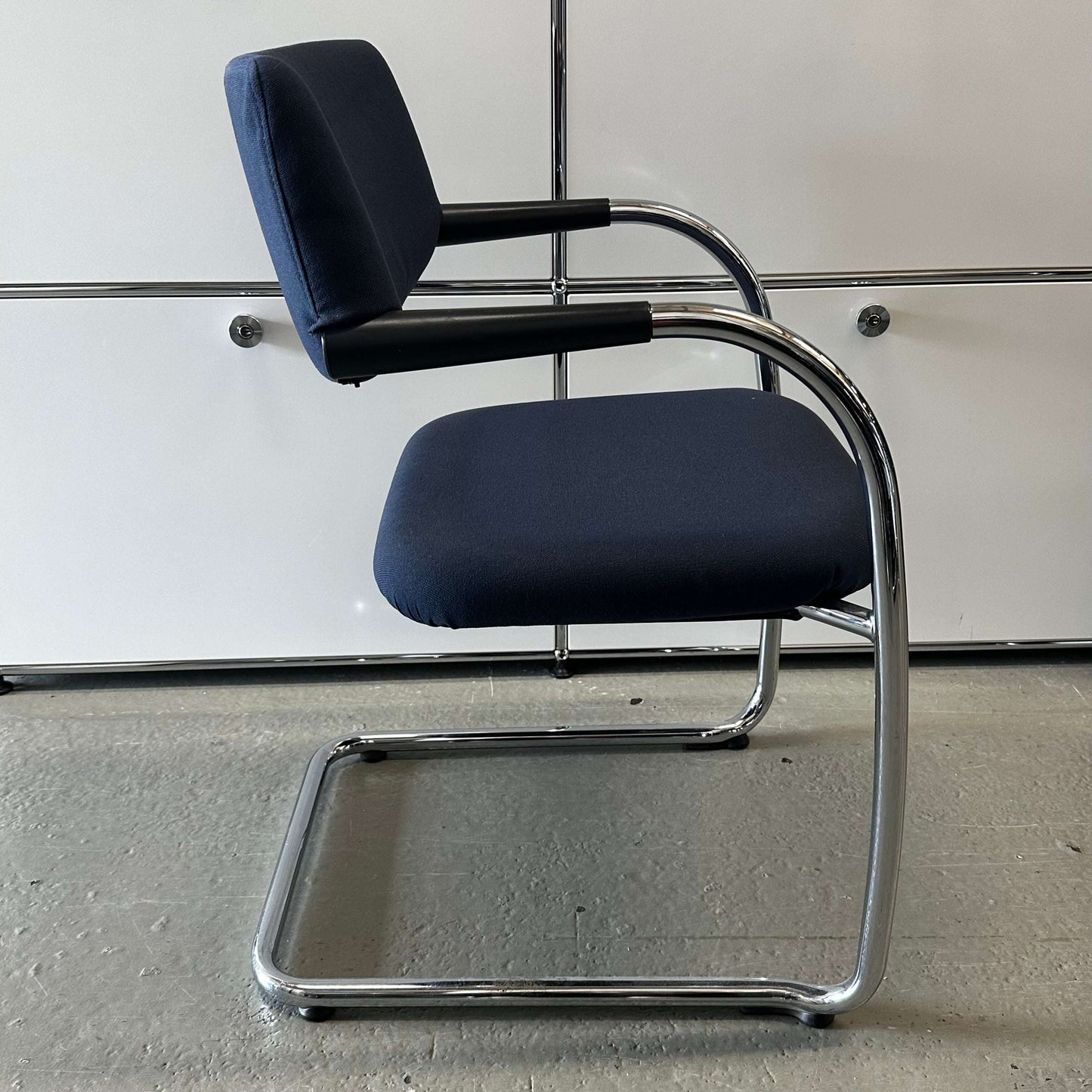 Vitra Visavis dark blue Softback chair with padded backrest and chrome cantilever frame