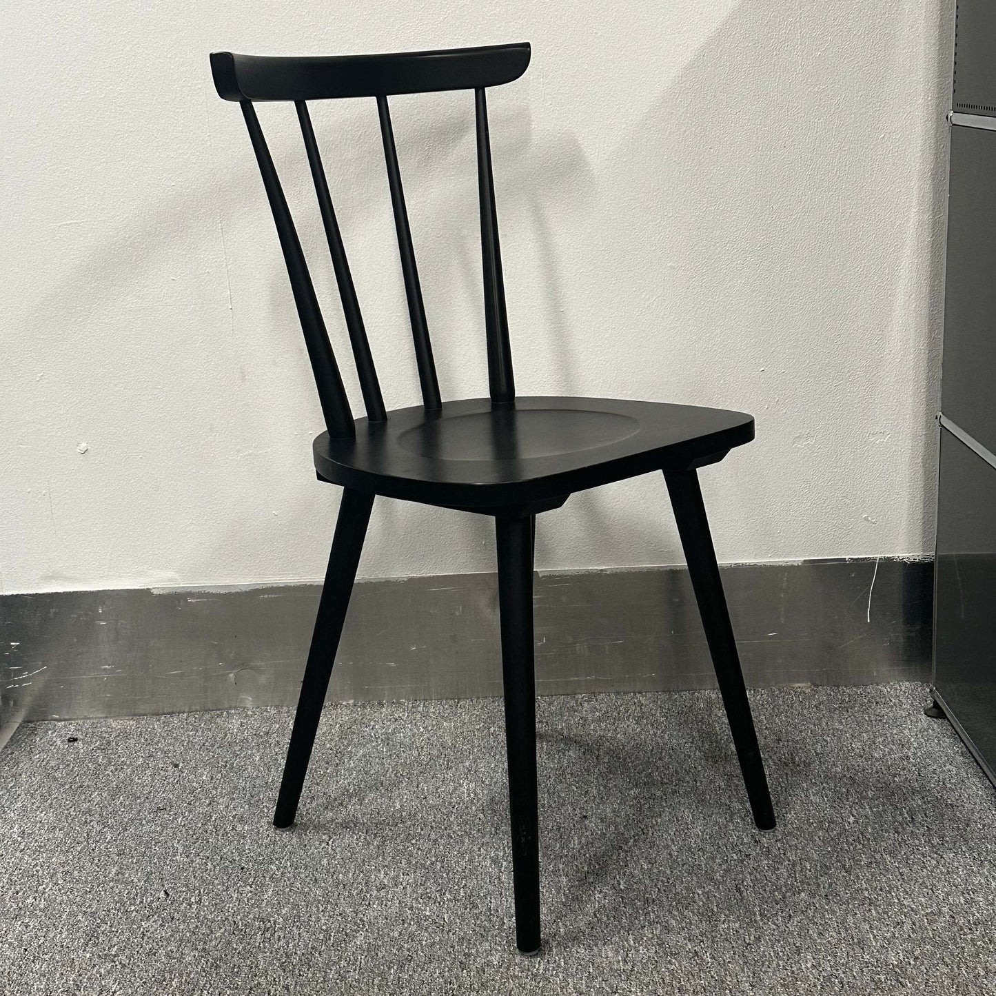 Black Wagner W-1960 Chairity wooden chair with a minimalist modern design and ergonomic backrest.