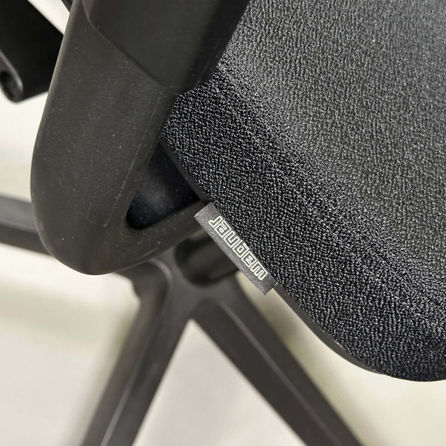 Close-up of black Wagner W1 office chair seat and mesh back with adjustable ergonomic features