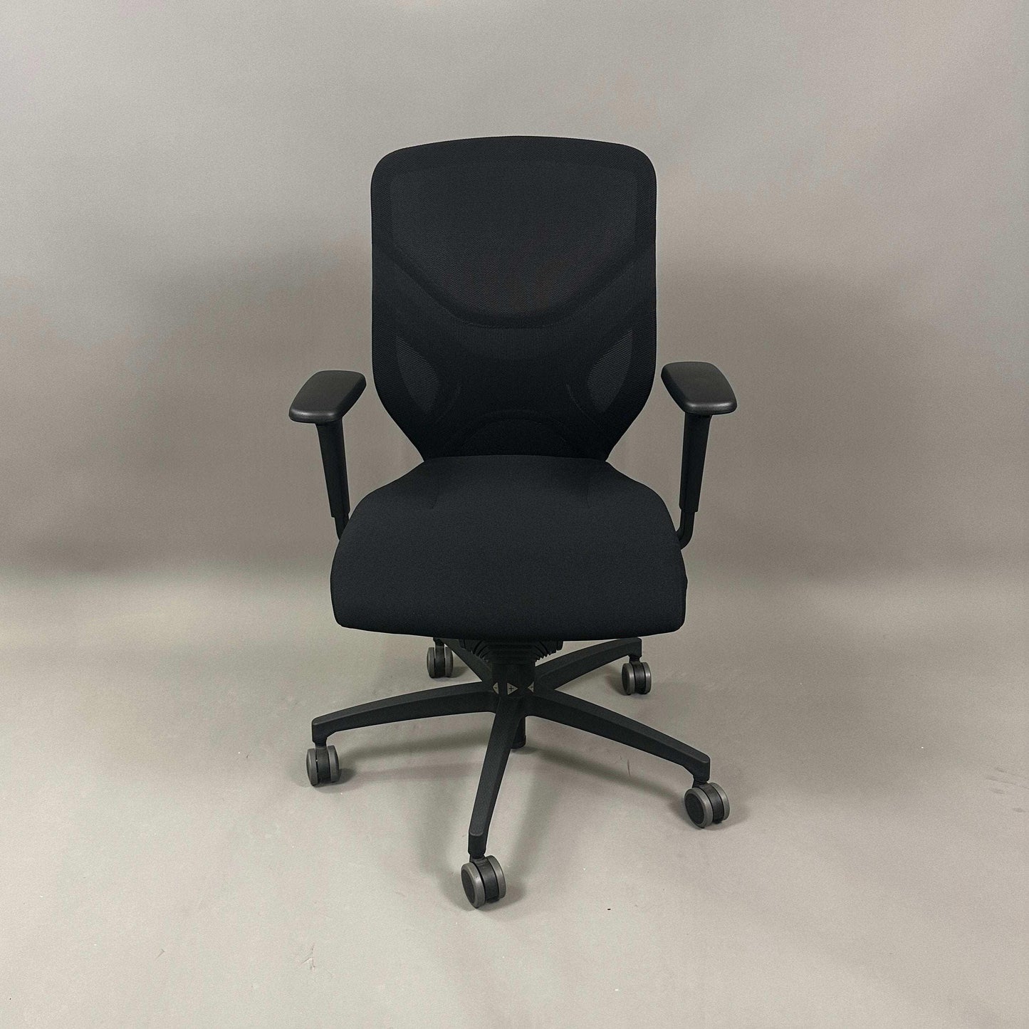 Wilkhahn IN ergonomic black office chair with adjustable height, 3D armrests, and soft wheels for hard floors