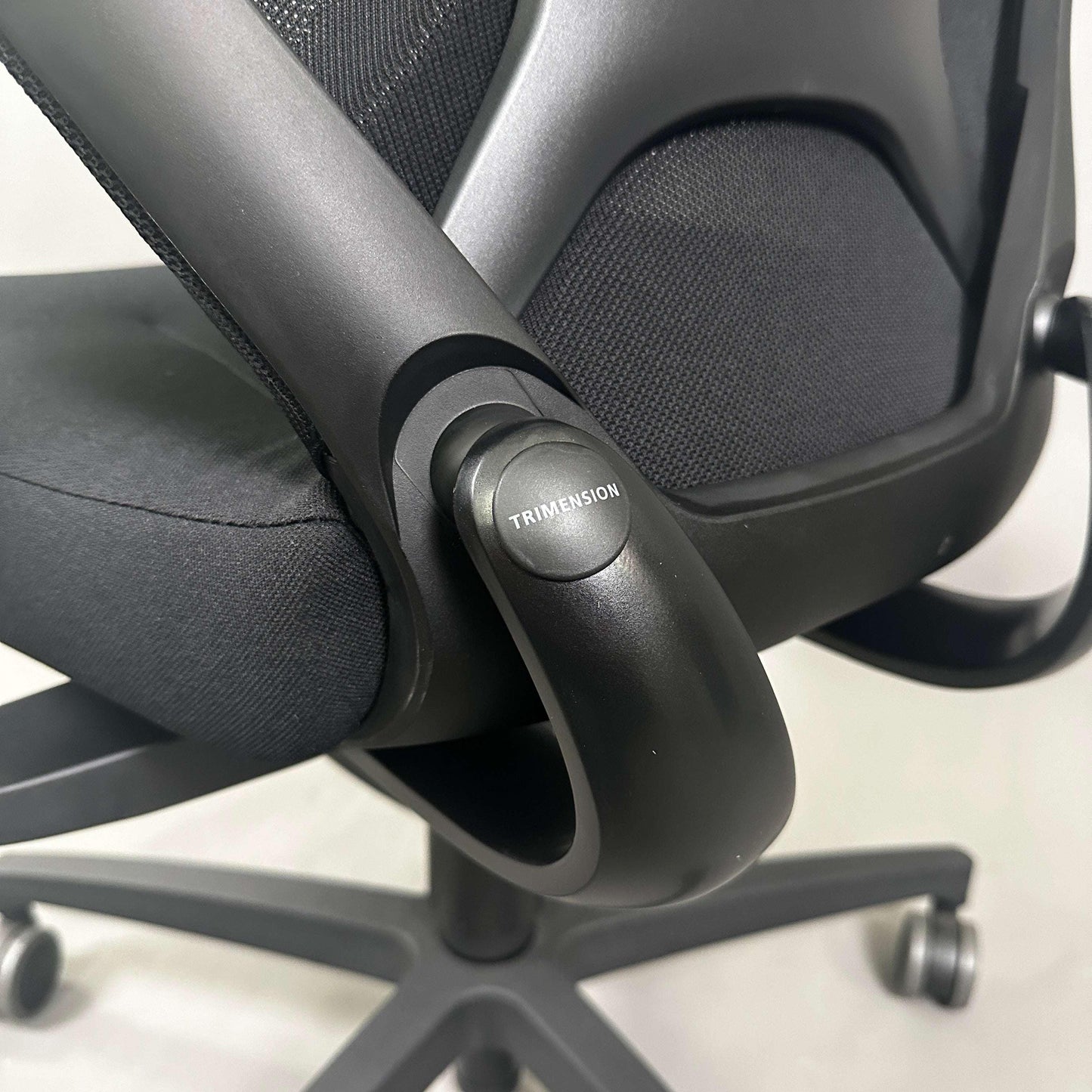 Wilkhahn IN office chair with black fabric, soft wheels for hard floors, 3D armrests, and trimension adjustment.