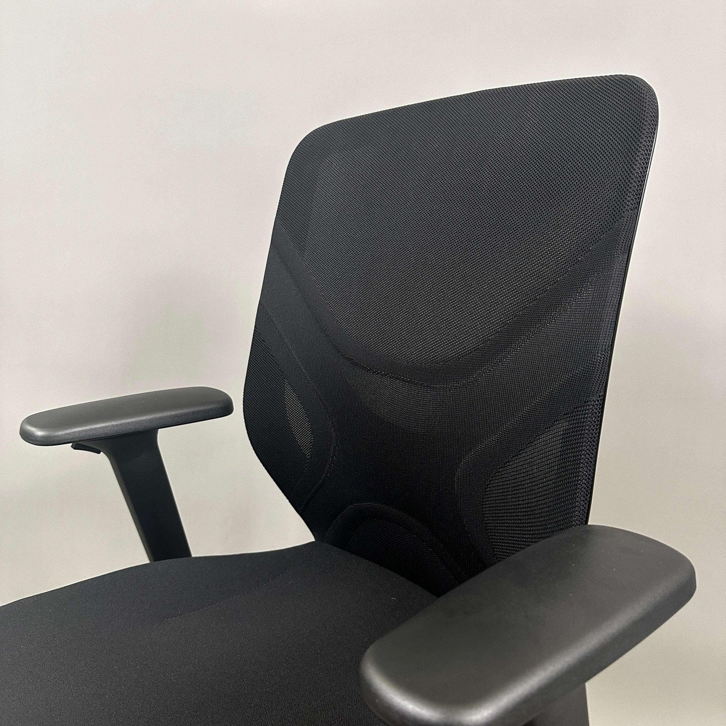 Wilkhahn IN ergonomic black office chair with adjustable height, 3D armrests, and soft wheels for hard floors