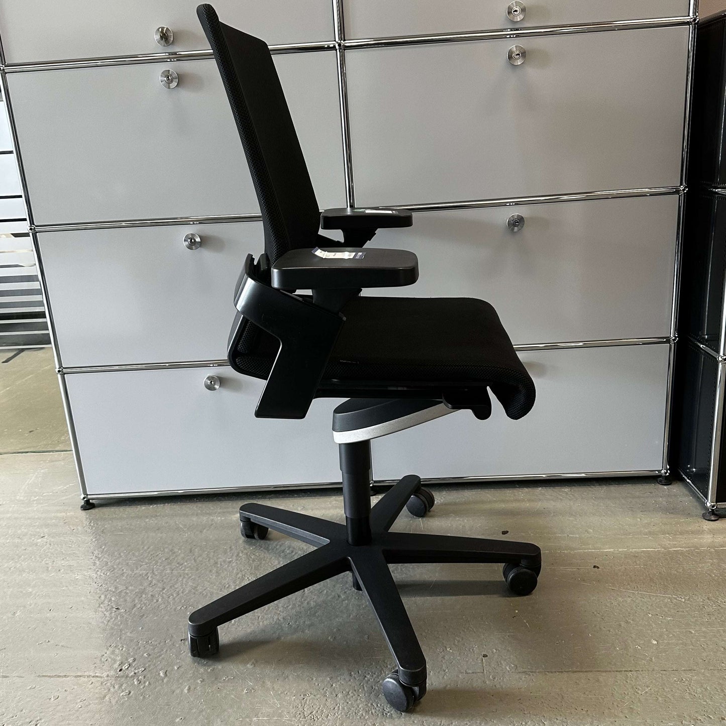 Black Wilkhahn ON ergonomic office chair with adjustable seat height, depth, and backrest, featuring Wilkhahn Trimension technology and lockable backrest.