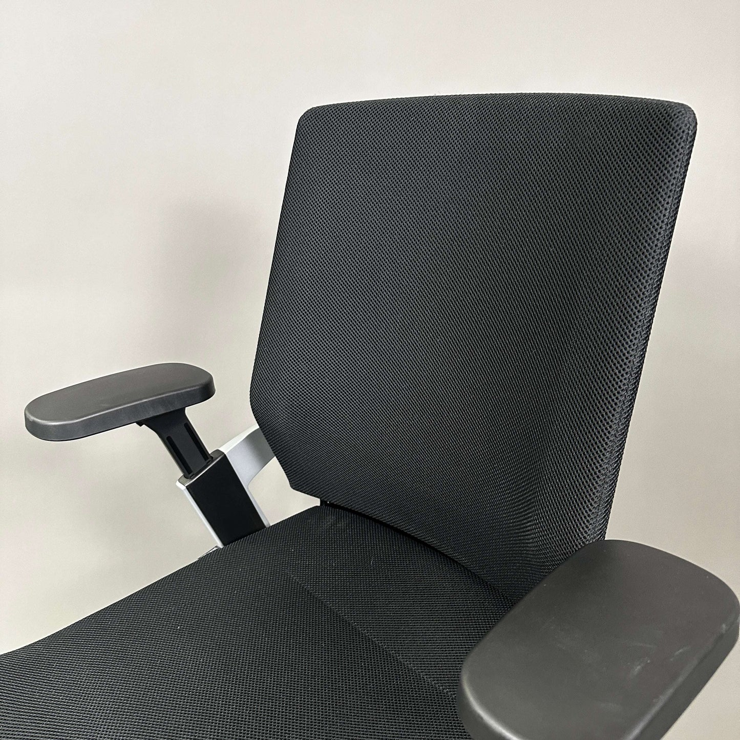 Wilkhahn ON ergonomic office chair with black mesh backrest and adjustable armrests
