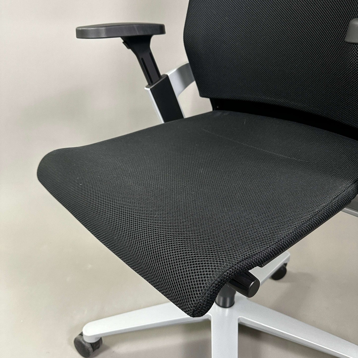 Black mesh and fabric Wilkhahn ON office chair with adjustable armrest and white aluminum base