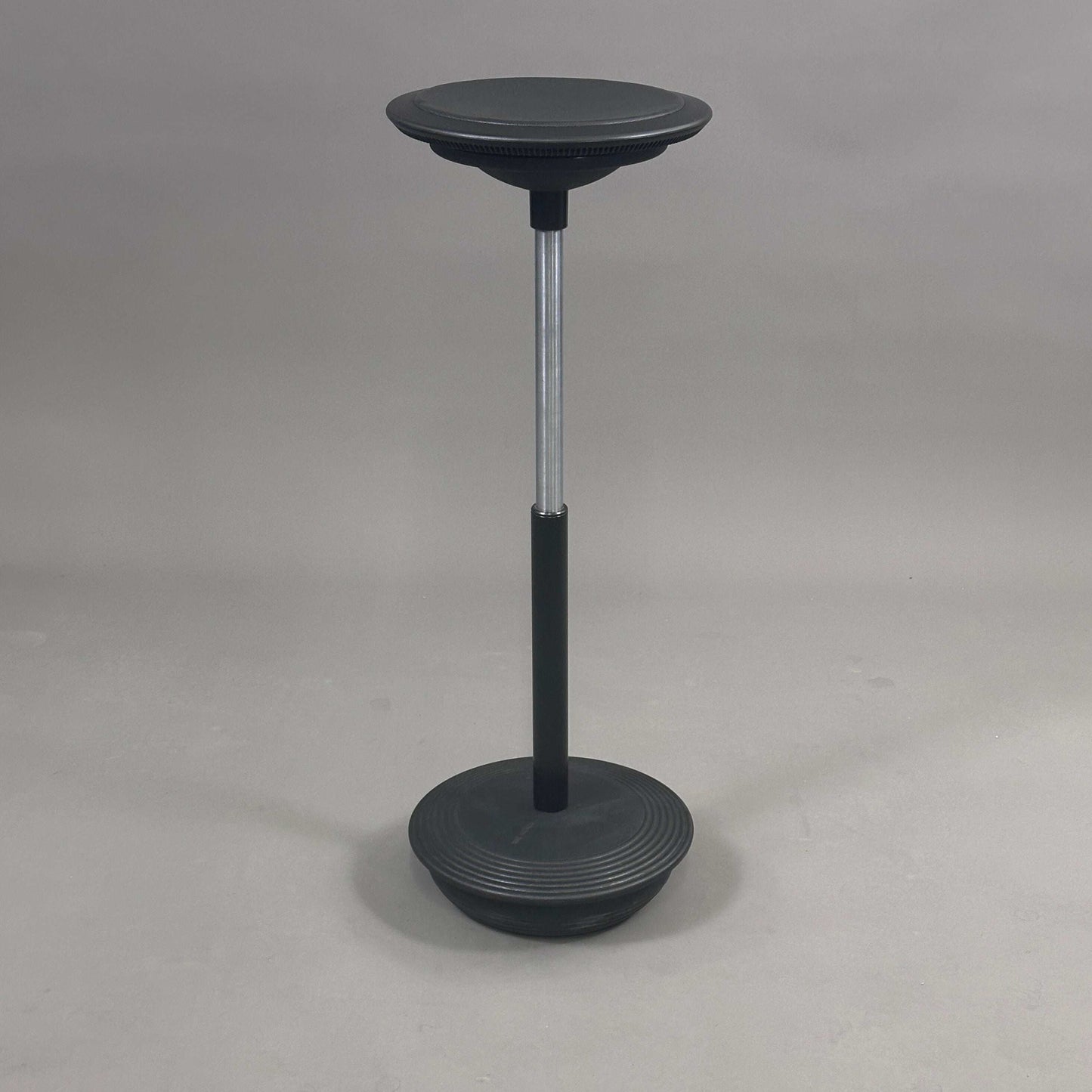 Wilkhahn Stehhilfe adjustable black leather seat stool with elastomer base and quartz sand filling