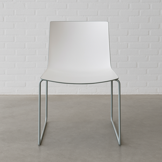 Arper Catifa 46 chair with white seat and steel sled base against white brick wall