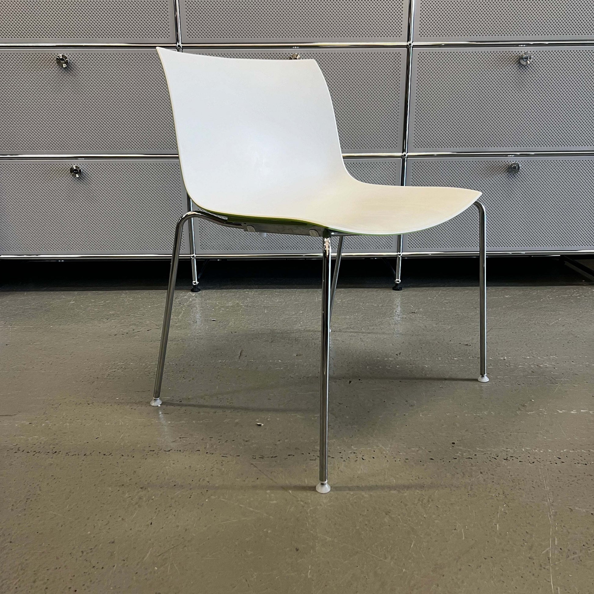 Arper Catifa 53 stackable white and light green chair with metal legs for indoor and outdoor use