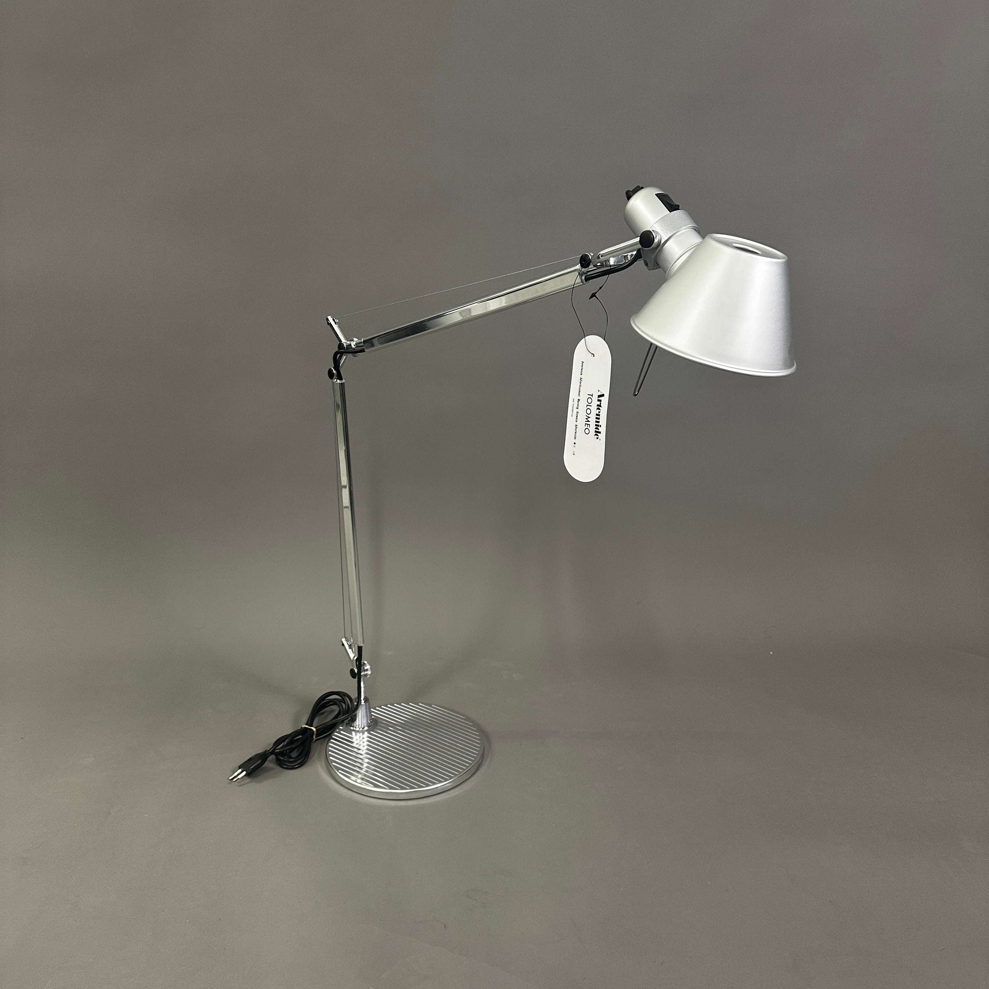 Artemide Tolomeo Tavolo polished aluminum adjustable desk lamp with round base and conical shade