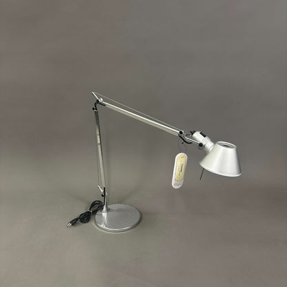 Artemide Tolomeo Tavolo desk lamp with polished aluminum body and adjustable arm on round base
