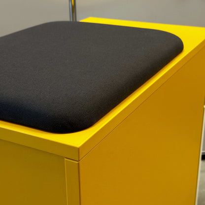 Yellow Rollcontainer CT with anthracite fabric seat cushion and white melamine front panel