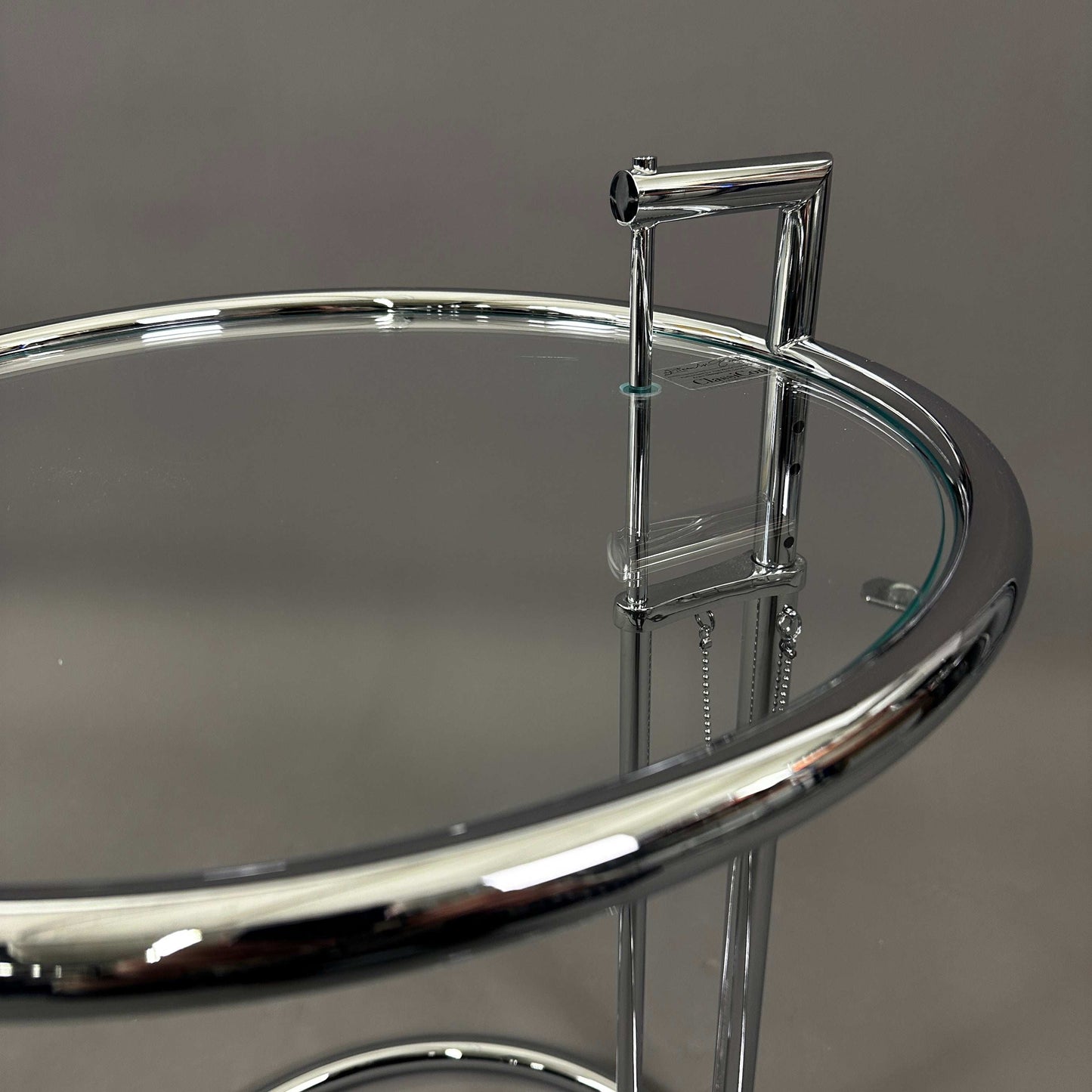 ClassiCon Eileen Gray Beistelltisch with adjustable chrome steel frame and glass tabletop
