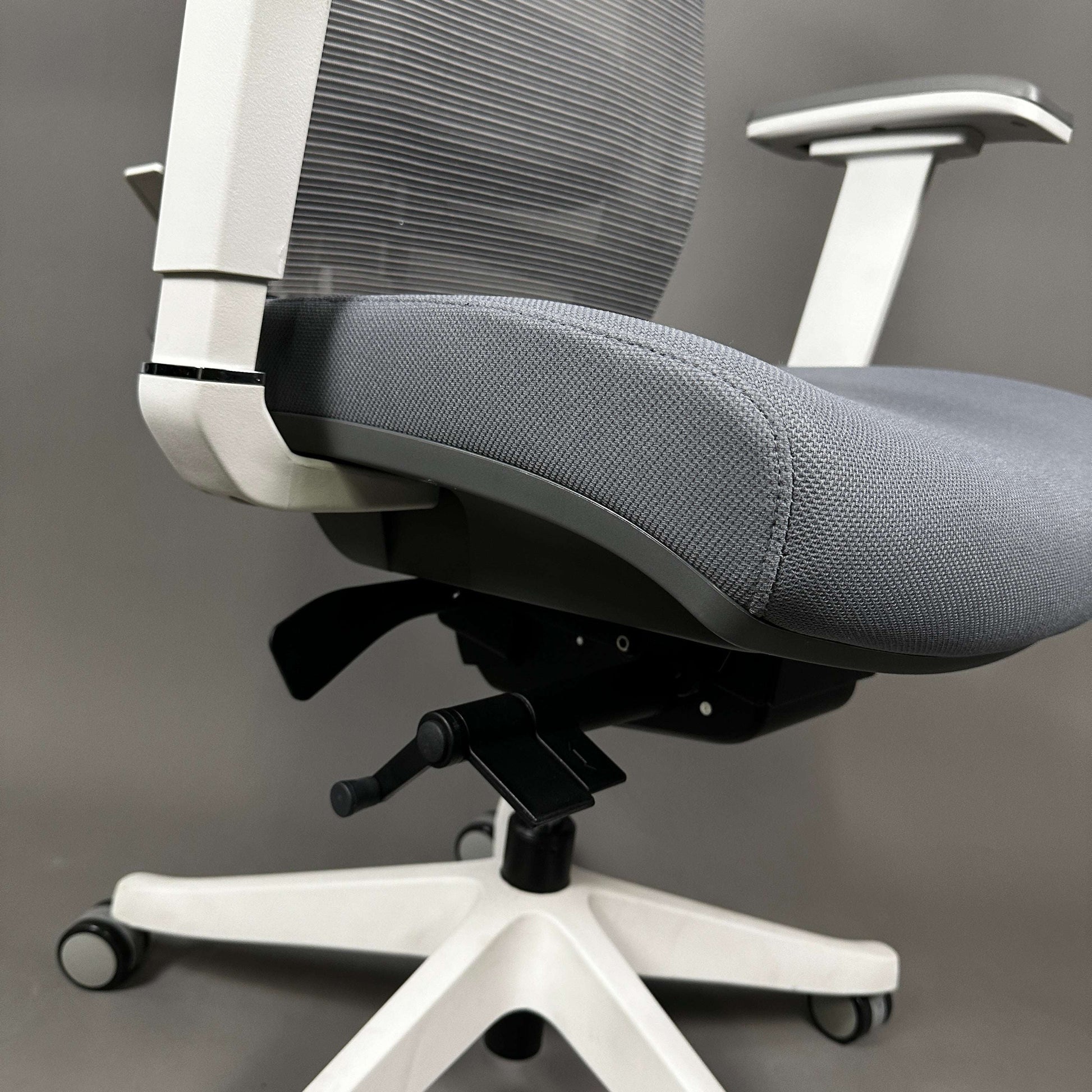 Ergonomic office chair Ergo1 with white aluminum frame, gray fabric seat, and adjustable gray mesh backrest and headrest