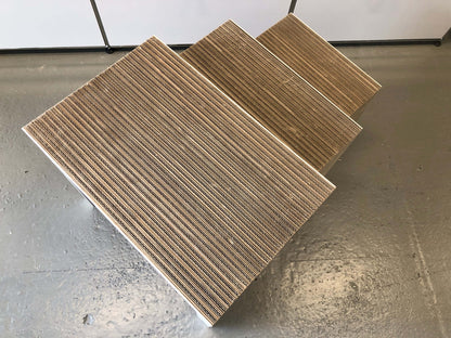 Frank Gehry low table set of three nesting side tables made of corrugated cardboard with white matte painted wood legs