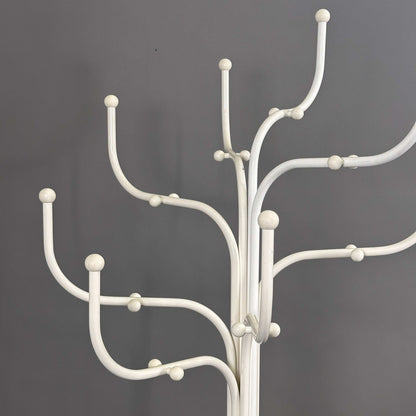 White Fritz Hansen Coat Tree with multiple curved hooks against a gray background
