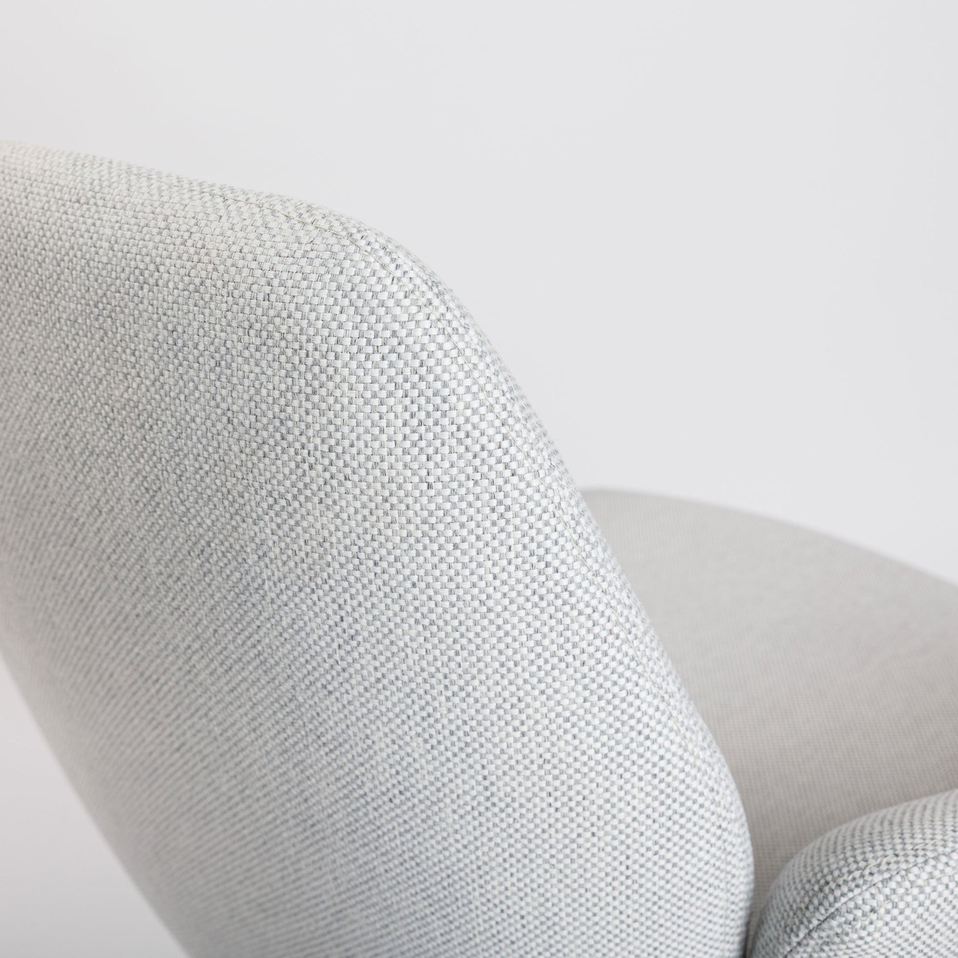 Haworth Poppy Conference Chair in hellgrau fabric, showing textured backrest and seat.