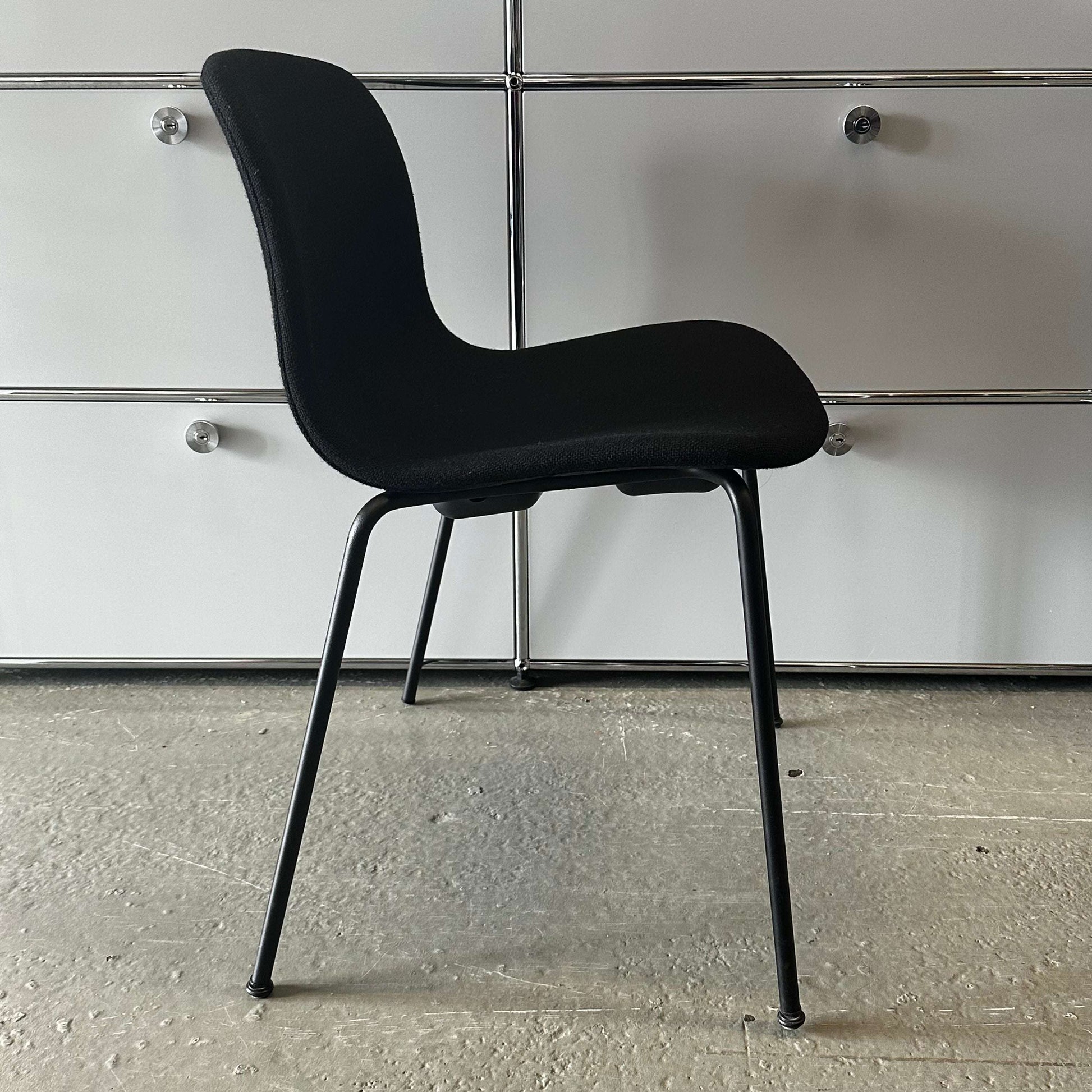 Modern black Hay Chair AAC 17 with sleek design and metal legs against a white background