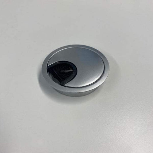 Round matte chrome metal cable grommet with dust seal for desk installation 60mm diameter, positioned 7cm from edge